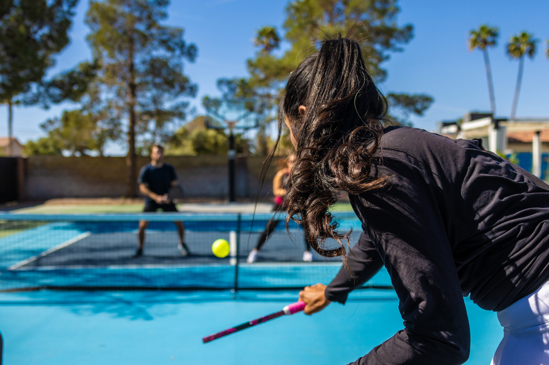 People playing pickleball on a court